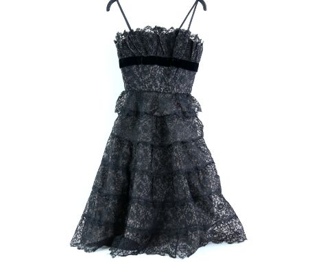Collection of Vintage dresses to include an early 1960s black tiered lace cocktail dress, together with two other vintage eve