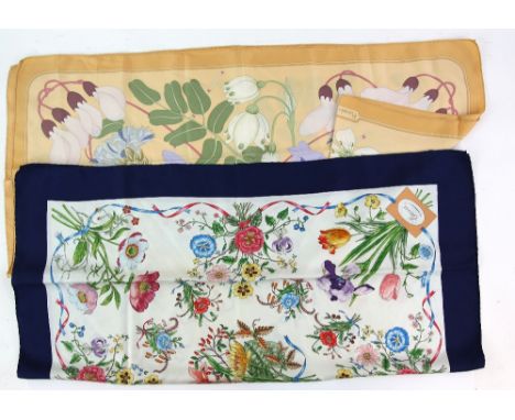 Hermes silk scarf , floral design on an apricot ground and a Gucci Scarf flowers in bold colours.       