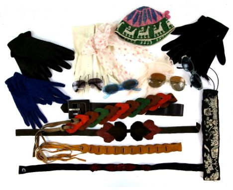 A collection of vintage suede belts, two pairs of 1950s sunglasses and two other pairs, a collection of gloves and a hat with