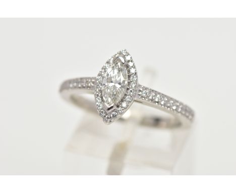 A PLATINUM DIAMOND HALO RING, centring on a marquise cut diamond, estimated diamond weight 0.50cts, colour assessed as J, cla