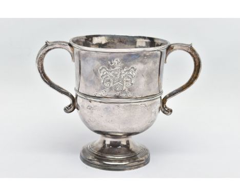 A GEORGE II SILVER TWIN HANDLED CUP, with S scroll handles, the front and back engraved with different crests, one of which i