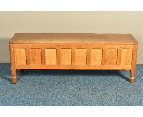 ROBERT 'MOUSEMAN' THOMPSON OF KILBURN, AN OAK PANELLED BLANKET CHEST, with a rectangular adzed lid, octagonal block legs, and