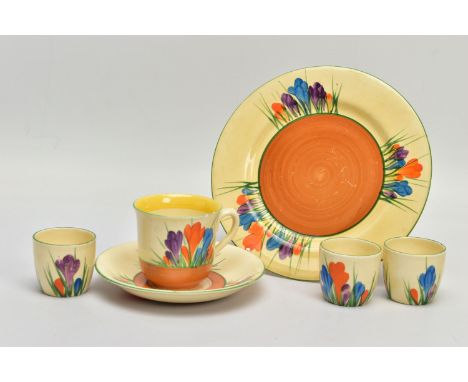 SIX PIECES OF CLARICE CLIFF AUTUMN CROCUS PATTERN ITEMS, comprising three egg cups with Bizarre backstamp, a coffee cup, sauc