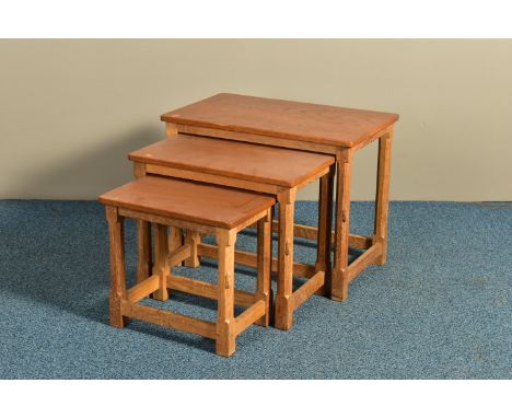 ROBERT 'MOUSEMAN' THOMPSON OF KILBURN, AN OAK RECTANGULAR NEST OF THREE TABLES, adzed top to each table, on four octagonal le