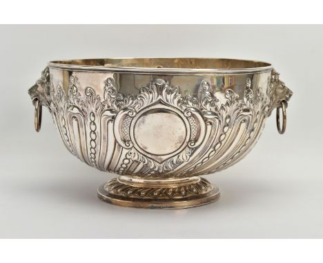 A VICTORIAN SILVER PUNCH BOWL, with cast lion mask and ring handles, the bowl repousse decorated with spiralled gadrooning  a