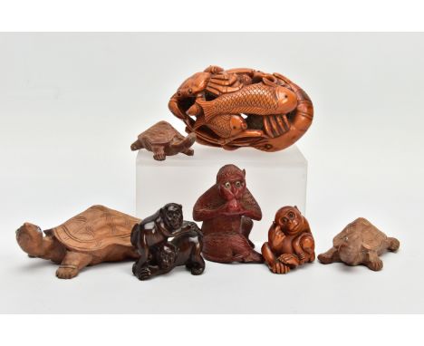 SEVEN JAPANESE CARVED WOODEN OKIMONO AND NESTSUKE, the okimono comprises an oval shaped carved and pierced boxwood group of f