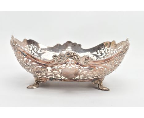 A GEORGE V PIERCED SILVER DISH OF SHAPED RECTANGULAR FORM, wavy rim with cast scrolls above pierced foliate decoration with t