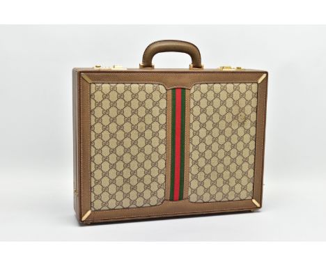 A VINTAGE GUCCI BRIEFCASE WITH GREEN LEATHER TRIM, the front and back vinyl panels with Gucci logos and red and green fabric 