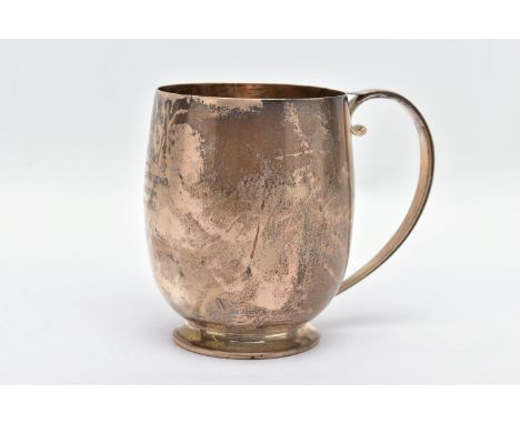 AN ELIZABETH II SILVER MUG, a bell shaped mug with a scrolled handle and skirted foot, engraved 'M.C &amp; M.T.G.S Dunlop Cup