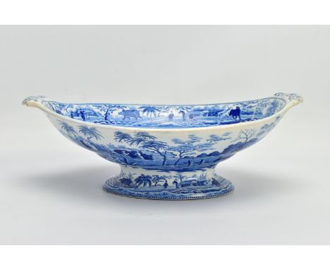 AN EARLY 19TH CENTURY SPODE EARTHENWARE BLUE AND WHITE TRANSFER PRINTED CARAMANIAN SERIES OVAL PEDESTAL BOWL, decorated in th