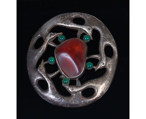 Oscar Dahl (Danish) - A silver Arts & Crafts buckle, set with a large centre cabochon amber within a surround of stylised gee