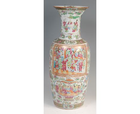 A 19th century Chinese Canton floor vase, decorated in bright enamels with reserves of ceremonial figure scenes within gilt b