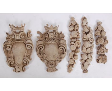 A pair of circa 1800 carved wood and composition wall mouldings, each as a vacant cartouche within a scrolling surround, surm