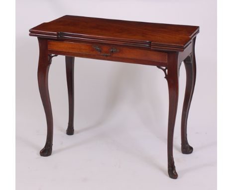 A George III mahogany card table, the fold-over top having proud corners and dished counter wells above a concertina rear act