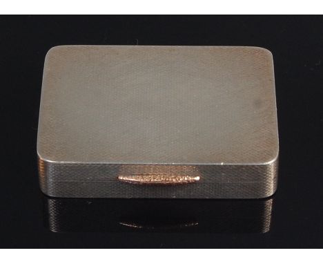 A mid-20th century silver snuff box, having gold thumbpiece, engine turned and with gilt washed interior, 1.7oz, W H Manton L