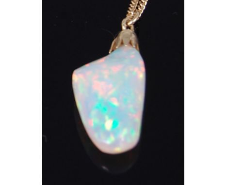 A heavily polished opal pendant on 14ct gold finelink neck chain, the 9ct opal reputedly from Ethiopia's Welo mine, gross wei