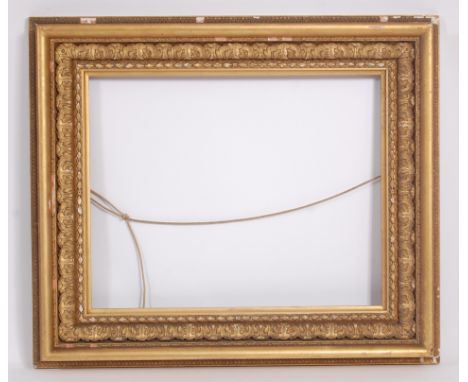 A late Victorian giltwood and gesso picture frame, carved with acanthus leaves within ropetwist and cavetto surround, gross d