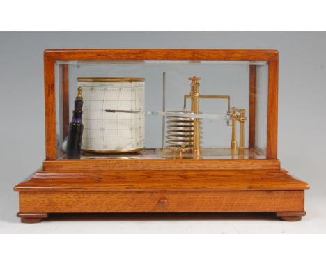 An oak cased barograph by Gray & Selby of Nottingham and Mansfield, having seven tier vacuum and base drawer for paper scales