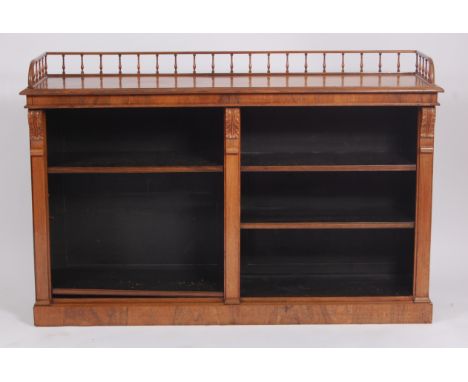 A William IV rosewood open bookcase, having a spindle turned three quarter gallery above twin flights of adjustable shelves, 