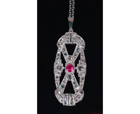 A 19th century white metal ruby and diamond set openwork pendant, of good size, the centre set old brilliant cut ruby weighin