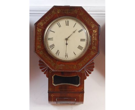 A late Regency rosewood cased droptrunk wall clock, the case with brass inlays and enclosing unsigned convex white enamel dia