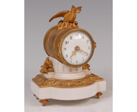 A 19th century French ormolu and white marble mantel clock, of small proportions, the drum case surmounted with a winged bird