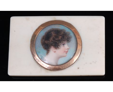 Adam Buck (1759-1833) - Profile portrait miniature of a boy, watercolour on ivory, framed in yellow metal as a circle, signed