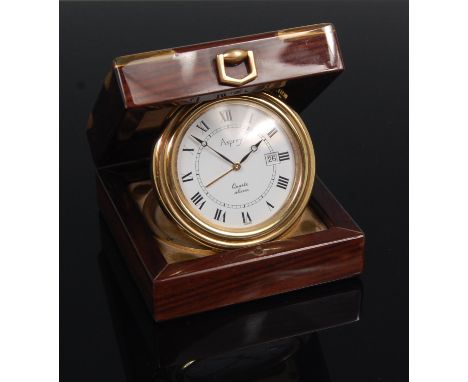 A contemporary Asprey travel alarm clock, housed in rosewood and brass bound case, the gilt brass cased quartz movement with 