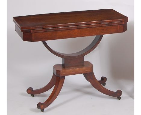 A Regency rosewood and crossbanded pedestal card table, the foldover top with canted corners and swivel action to a platform 