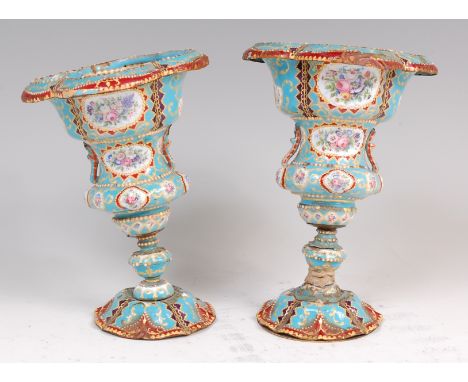 A pair of 19th century continental enamel on metal pedestal vases, each of lobed and knopped circular form, decorated in brig