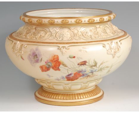 A Royal Worcester blush ivory jardiniere, the gilt heightened rim above a band of scrolling mask decoration, the bulbous body