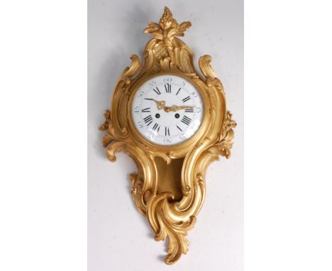 A French circa 1900 gilt bronze cartel clock, in the Louis XV style, the cast case of acanthus leaf scroll form with all-over