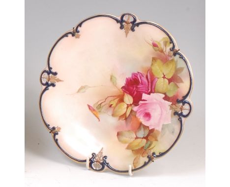 A Hadley's Worcester cabinet plate, enamel decorated with cabbage roses within a raised and moulded border, printed backstamp