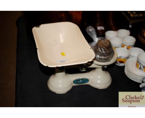 A set of vintage cast iron and enamel kitchen scales complete with weights 