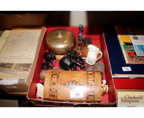 A  walnut two compartment tea caddy; various ebony elephants; a brass bell etc.