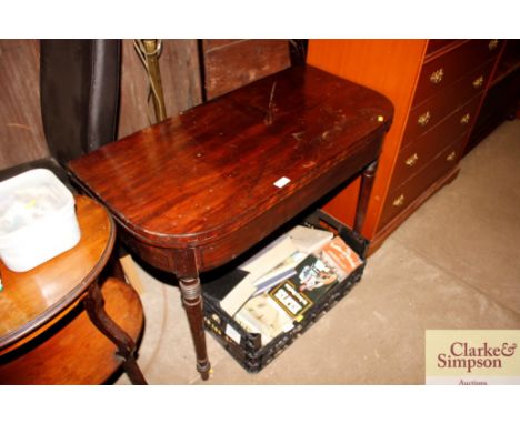A mahogany fold over card table 