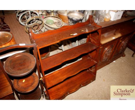 A mahogany hanging wall shelf fitted three drawers 