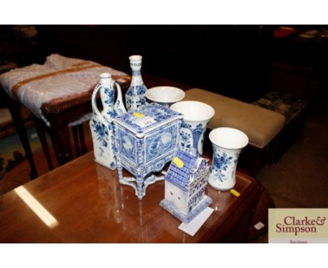 A Delft box and cover; and five 20th Century Delft vases; and a Delftware cottage 