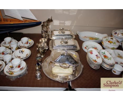 A pair of plated entreé dishes; a plated two section tureen; a bread board etc.
