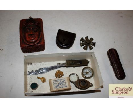 A box containing a compass, a seal etc.