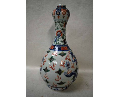 A late 19th century Chinese Bottle Vase of typical pear shape with expanded neck, white porcelain ground decorated in polychr