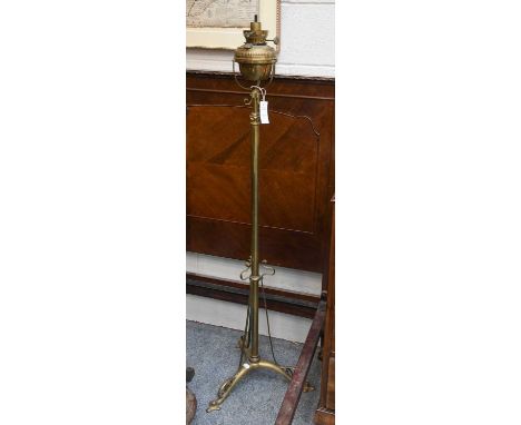 An Art Nouveau Brass Oil Lamp and Stand, with hinks burner, 155cm high