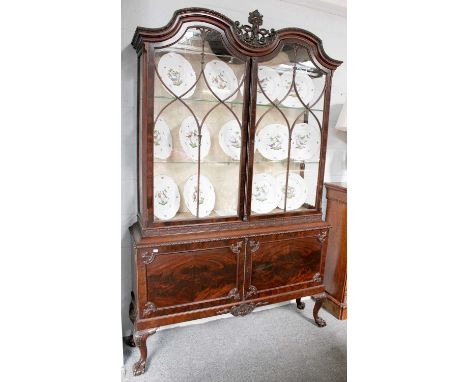 A 19th Century Mahogany Display Cabinet, the glazed upper section surmounted by pierced and carved scrollwork and blind fretw