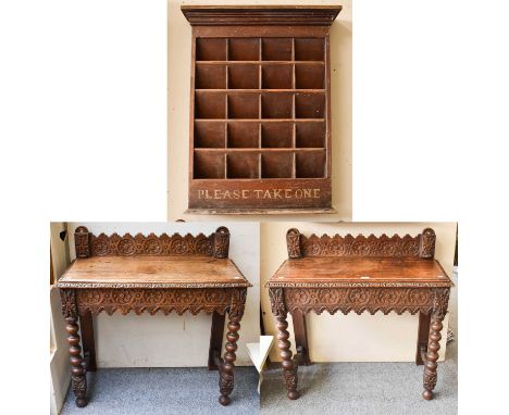 A Pair of Victorian Carved Oak Side Tables, 91cm by 41cm by 94cm, and a leaflet display stand, 76cm by 97cm