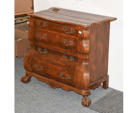 A Reproduction Hardwood Four Drawer Commode, the shaped top over a bank of four drawers with floral metal handles, supported 