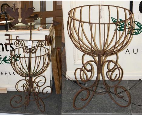 A Wrought Iron Weather Vane, 113cm high, and two wirework planters, 63cm high (3)