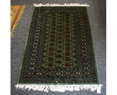 Melas CarpetThe field with a column of diamond medallions framed by spandrels and borders of stylised tulips, ??? x ???cm, to