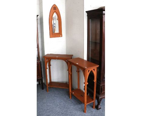 A Pair of Stained Gothic Side Tables, each 61cm by 28cm by 86cm; together with a similar arched mirror and a Victorian pitch 