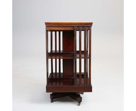 EDWARDIAN REVOLVING BOOKCASE. mahogany with inlaid top and ceramic castors, 85cm H x 46cm W.