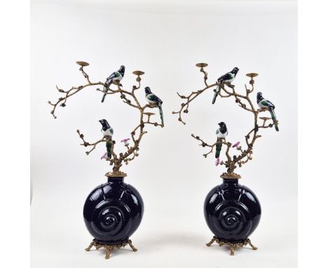 A PAIR OF BLUE SHELL AND BIRD CANDELABRA. ceramic and gilt metal, 64cm H x 44cm W.